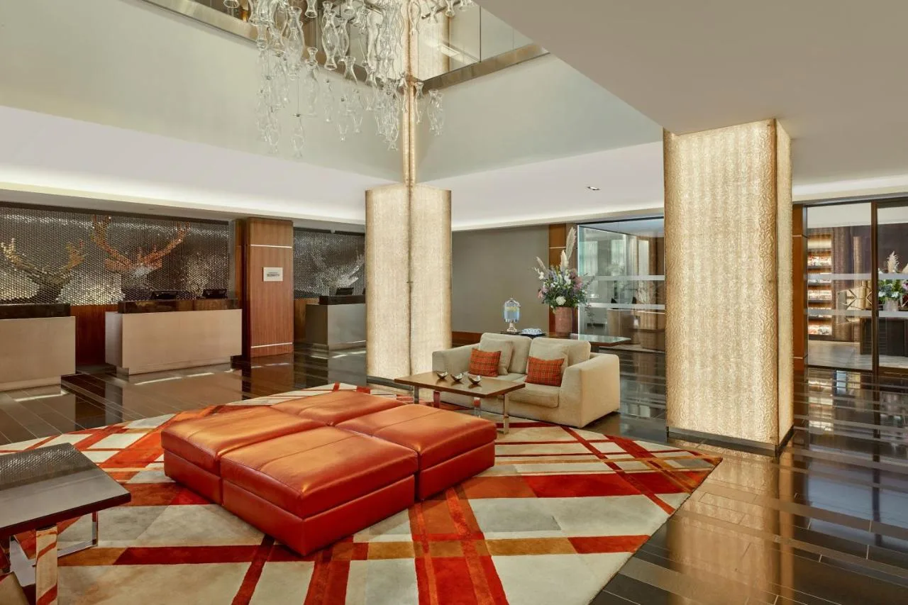 Living area with sofa in a suite at Sheraton Grand Hotel & Spa, Festival Square, Edinburgh