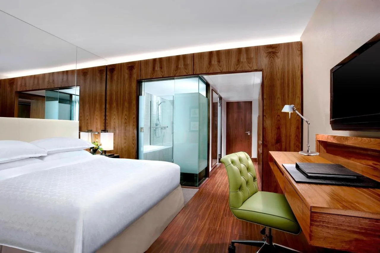 Bedroom with desk and television at Sheraton Grand Hotel & Spa, Edinburgh