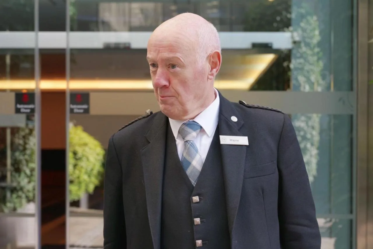 Member of staff welcoming guests outside Sheraton Grand Hotel & Spa, Edinburgh