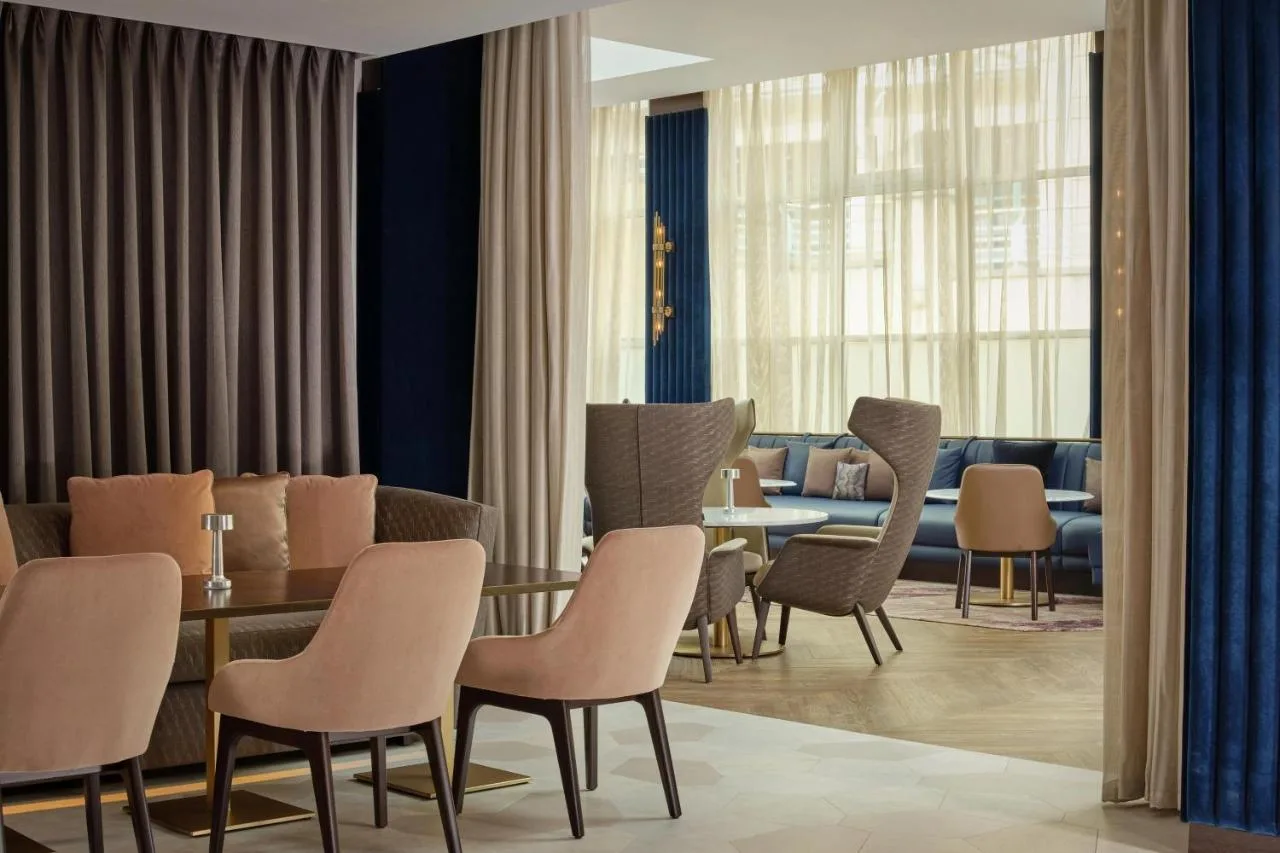 Dining room with sofa and table at Sheraton Grand Hotel & Spa, Edinburgh